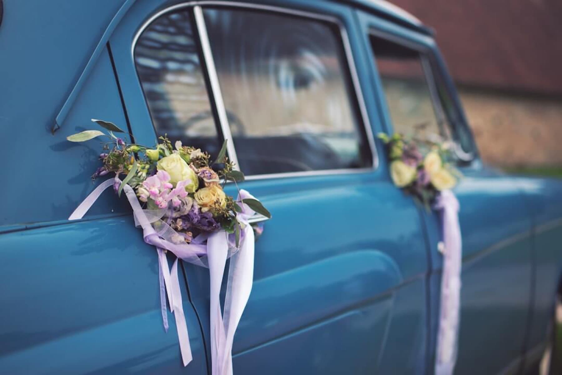 Decorated classic wedding car with floral ribbons for weddings in Waikato